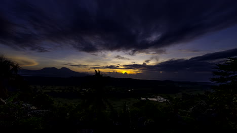 scenic sunrise time lapse with cloud movement over lush tenganan bali landscape