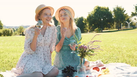 two friends enjoying a picnic in a park