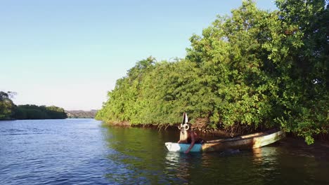 man dancing on ancient raft in oaxaca mexico with devil mask-4