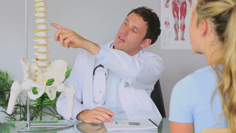 chiropractor talking with his patient