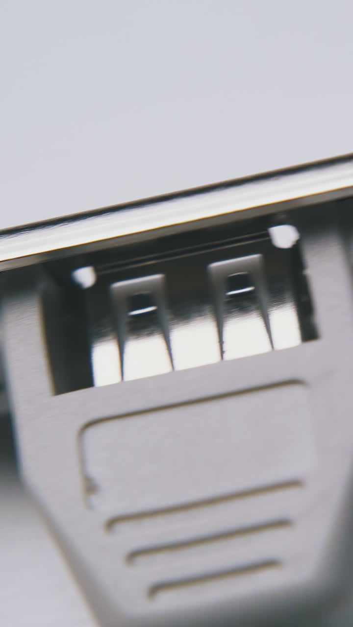 modern inner usb hub with wires and metal plank lies on clean white background extreme close view