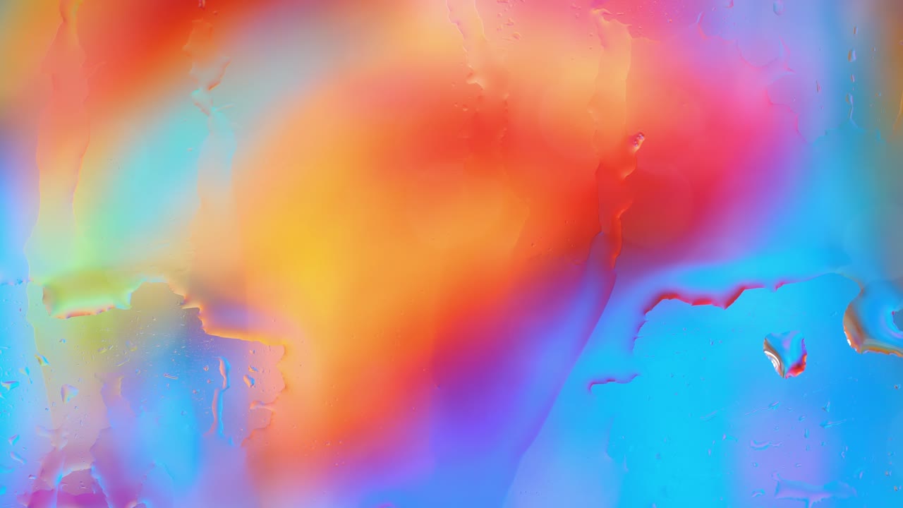Smooth colorful water on glass surface