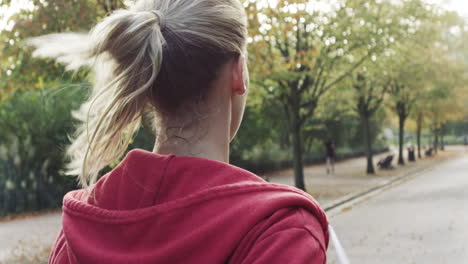 woman running pony tail close up behind shot