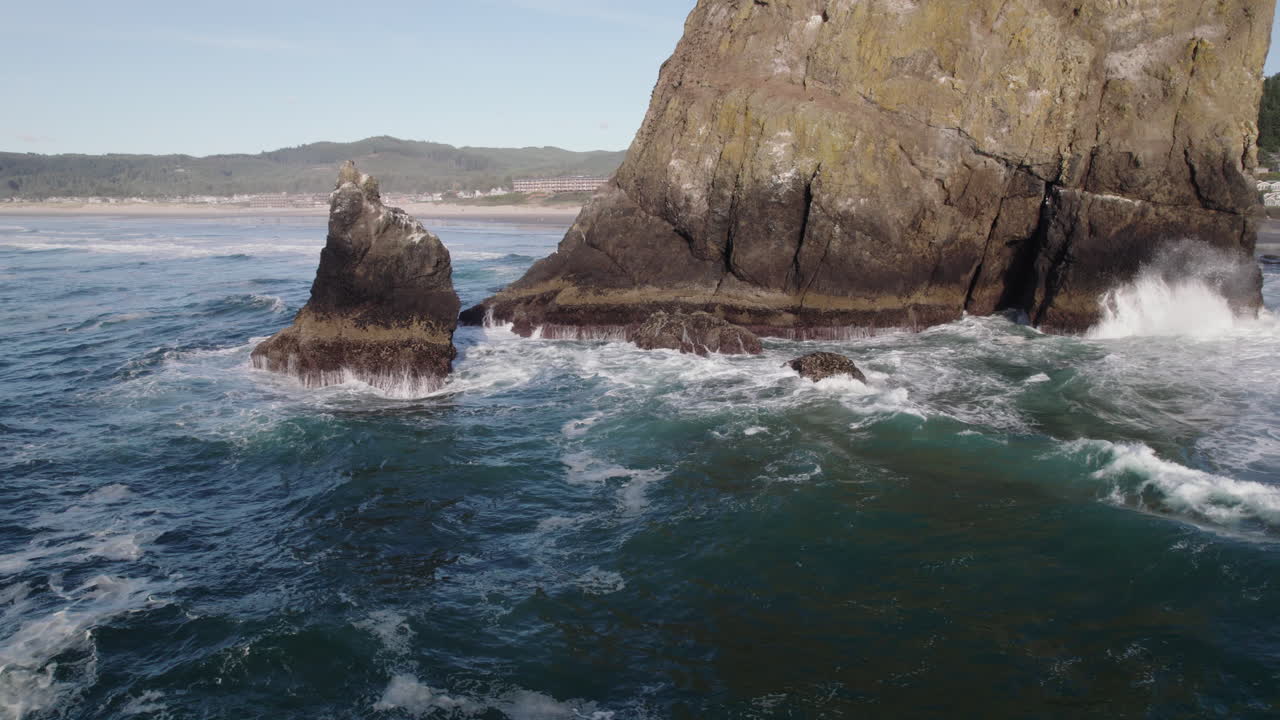 White capped waves crash against Haystack Rock in Oregon