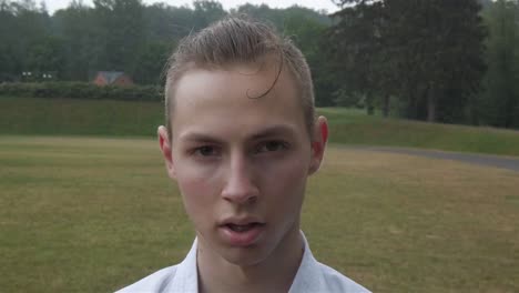 Young-teenager-karate-boy-slow-motion-profile-picture-in-the-rain