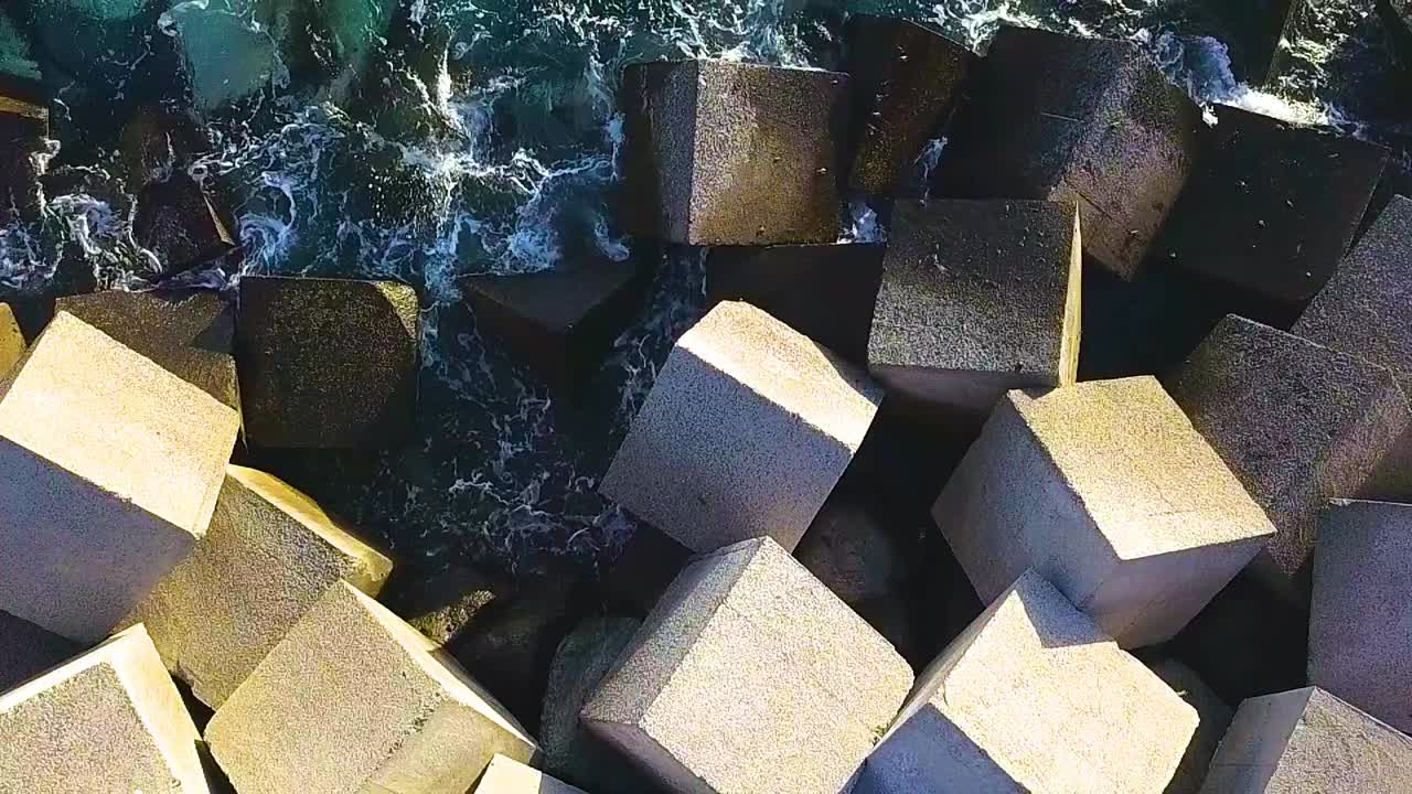 Aerial View of Concrete Tetrapods Breakwater on the Coast