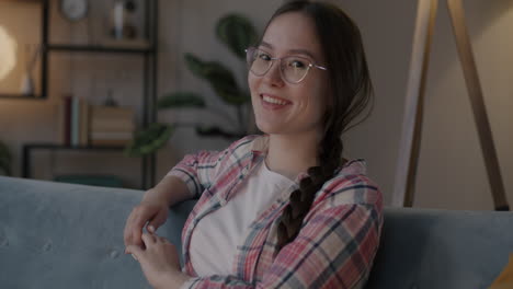 young woman relaxing on sofa