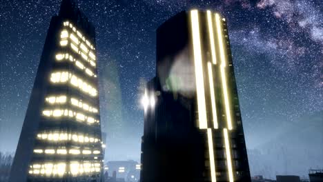 rascacielos de la ciudad por la noche con estrellas de la vía láctea