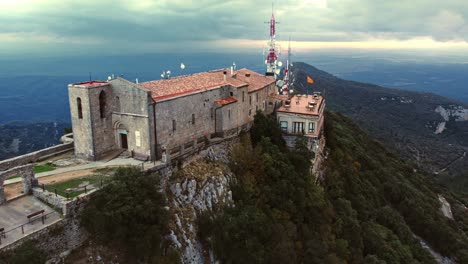 Drone-shot-orbiting-historic-and-beautiful-church-in-mountains-of-Spain