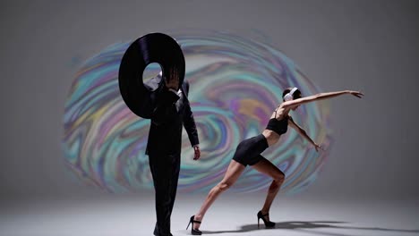 couple performing a modern dance with vinyl records