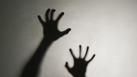 video of silhouettes of hands moving on white background