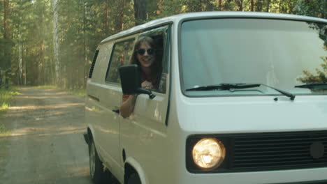 Woman-Looking-out-of-Van-Window-during-Road-Trip