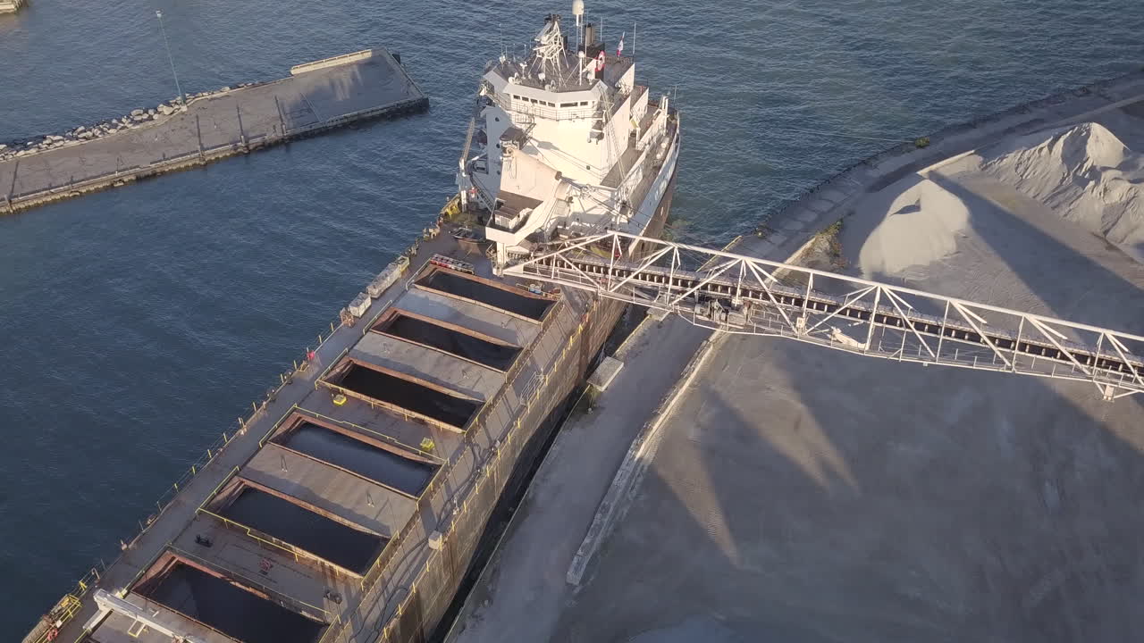 Sand Dredging Machine At The Port In Kingsville, Ontario, Canada - aerial drone shot