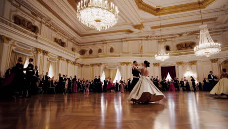 elegant couple dancing in a grand ballroom at a formal event