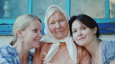 portrait of an elderly woman with two adult granddaughters 4k video