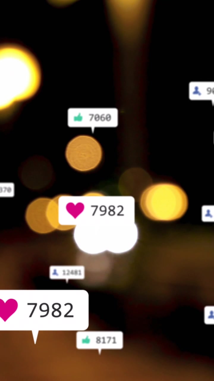 Animation of social media icons and numbers over out of focus city lights