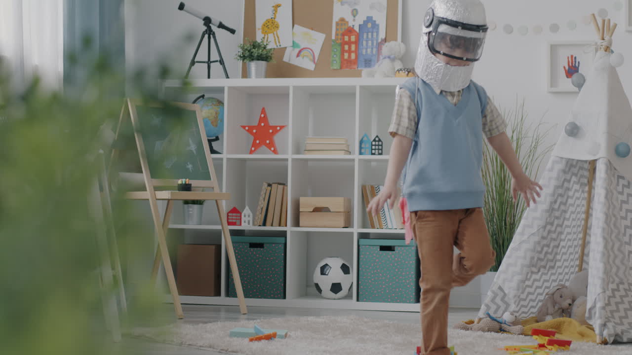 Child Playing in Playroom Dressed as an Astronaut