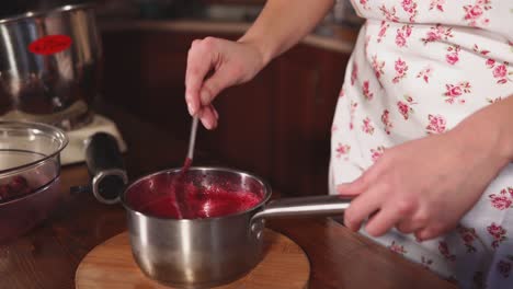 woman making berry jam