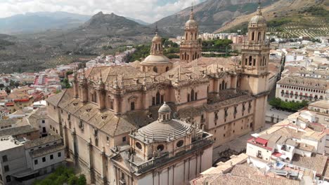 Spain-Jaen-Cathedral,-Catedral-de-Jaen,-flying-shoots-of-this-old-church-with-a-drone-at-4k-24fps-using-a-ND-filter-also-it-can-be-seen-the-old-town-of-Jaen