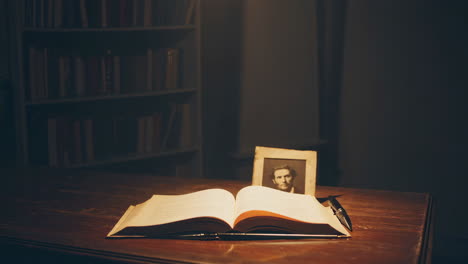 study room with open book and portrait