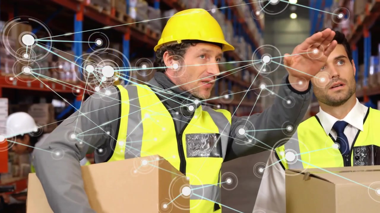 Hard hat worker showing warehouse plan while lead listening digital network appearing mapping racks