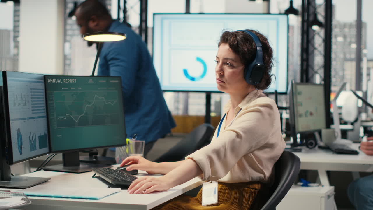 Vertical Video Office administrator uses focus music on headset to solve tasks