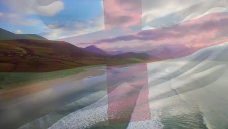 digital composition of waving england flag against aerial view of beach and sea waves