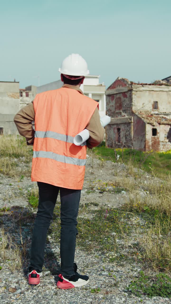 Architect On A Sunny Day At The Construction Site Looking Around