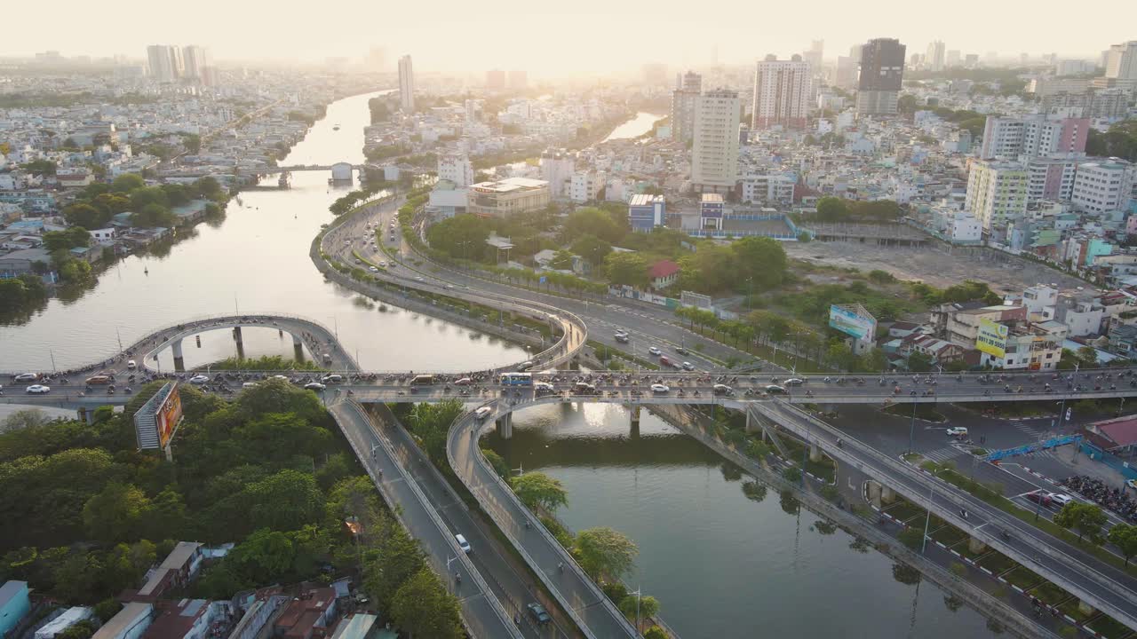 Motorcycles run on the bridge in the sunset afternoon Vietnam