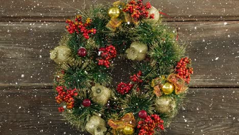 falling snow with christmas wreath decoration