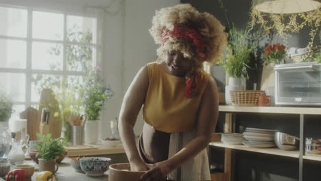 food blogger kneading dough and talking on camera