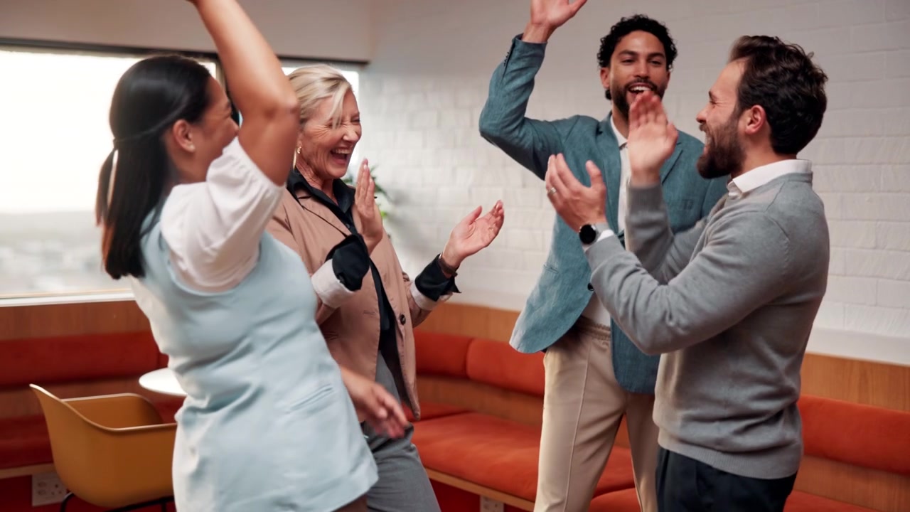 Diverse Business Team Celebrating Success with High Five and Applause