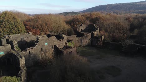 sunrise liverpool castle replica ruins in autumn rivington woodland nature landmark aerial view rising tilt down