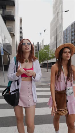 two friends walking on a city street