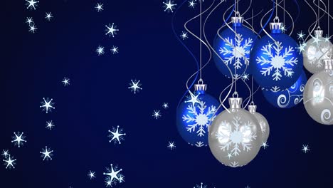 Animation-of-blue-and-silver-christmas-baubles-decoration-and-snowflakes-falling-on-blue-background