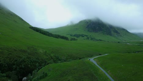 a country road track in the midst of countryside in gloomy clouds