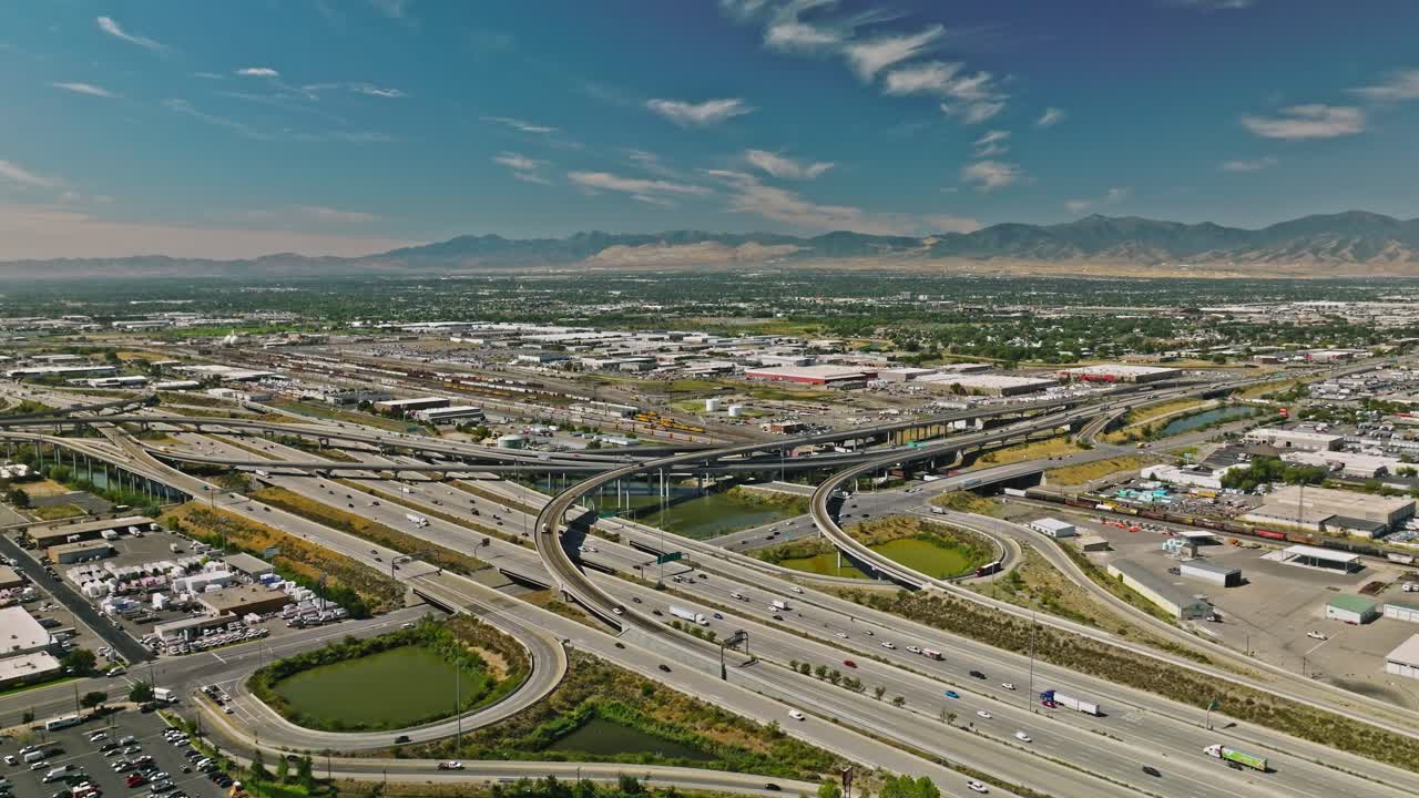 Traffic crossing on complex highway with downtown cityscape