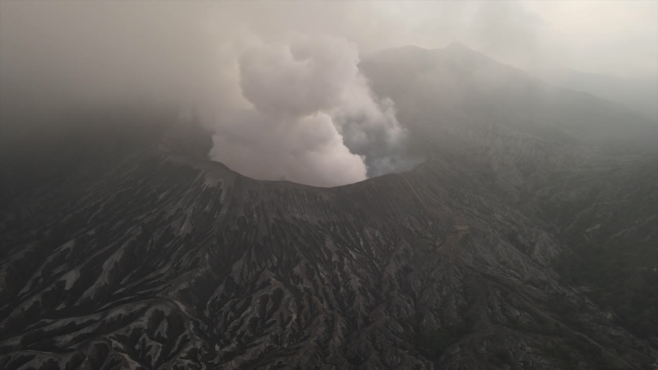 Mount Bromo active somma volcano Java Indonesia nature, aerial drone volcanic landscape, timelapse