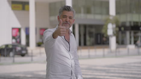 happy mature man talking at camera