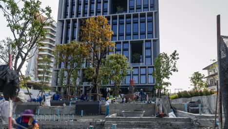 a time lapse of workers working on a construction site in bangkok, thailand