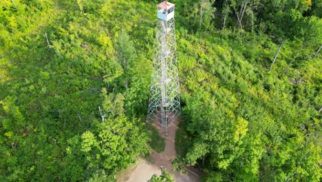 100-feet tall mountain fire lookout tower in the middle of nicolet national forest, wisconsin, usa