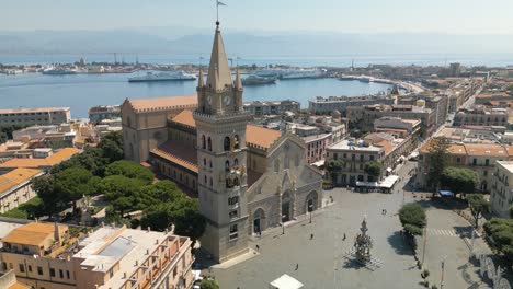 beautiful establishing shot of messina, italy with port in background