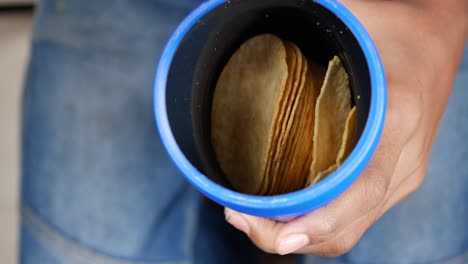 Hand-pick-chips-from-a-container-,