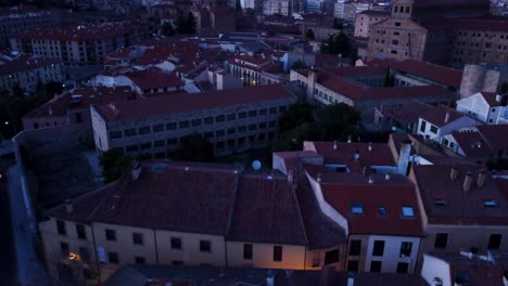 Aerial-of-Salamanca-Spain-featuring-a-small-district-within-the-city-at-night