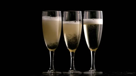 animation of burning layer over glasses of champagne