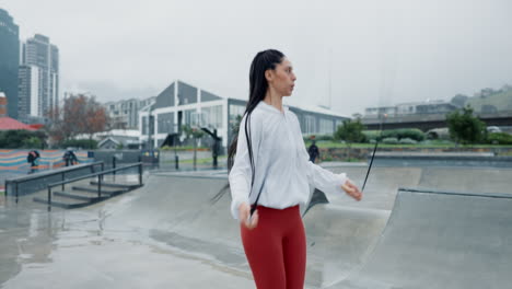 Woman,-fitness-and-skipping-rope-in-city