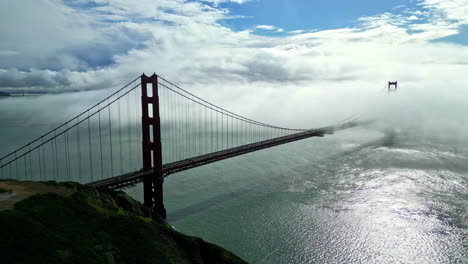 mist partially covers golden gate bridge over strait, san francisco