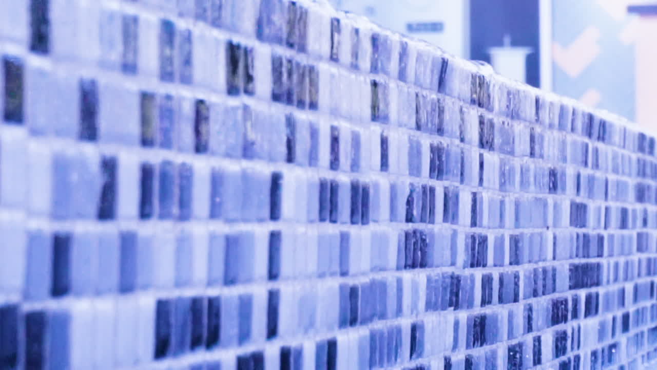 Close up fixed shots at a corporate building entrance people walking thru two fountains of water calm and flowing water [HD1920x1080]59,94fps