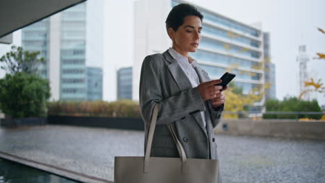 Corporate-manager-typing-message-going-downtown.-Busy-woman-commuting-texting