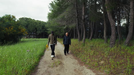 two men walking along a country path for a picnic
